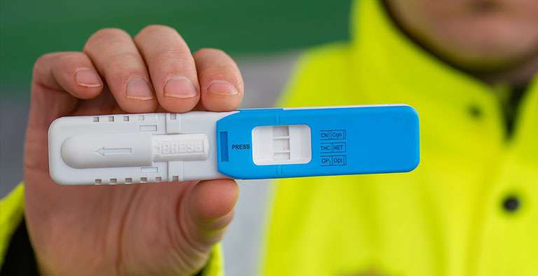 Police officer conducting roadside drug-driving test amid rising Drug Driving Offences in UK