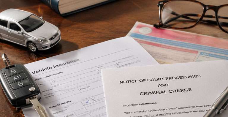 Elderly driver facing a Single Justice Procedure notice after a car insurance typo